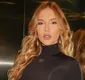 
                  Virginia é barrada na imigração por mudança estética: 'Desespero'