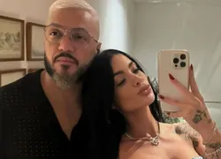 Com a namorada em 'A Fazenda', Belo sai de show com outra mulher