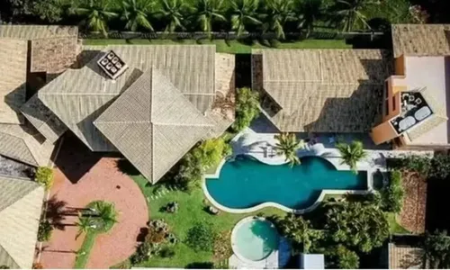 
					Piscina em formato de violão e boate: os detalhes da mansão de luxo de Netinho em destino paradisíaco na Bahia
				
				