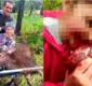 
                  Homem posta foto de filha de 8 anos mordendo coração de cervo