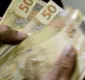 
                  Beneficiários com NIS final 5 recebem hoje Auxílio Brasil